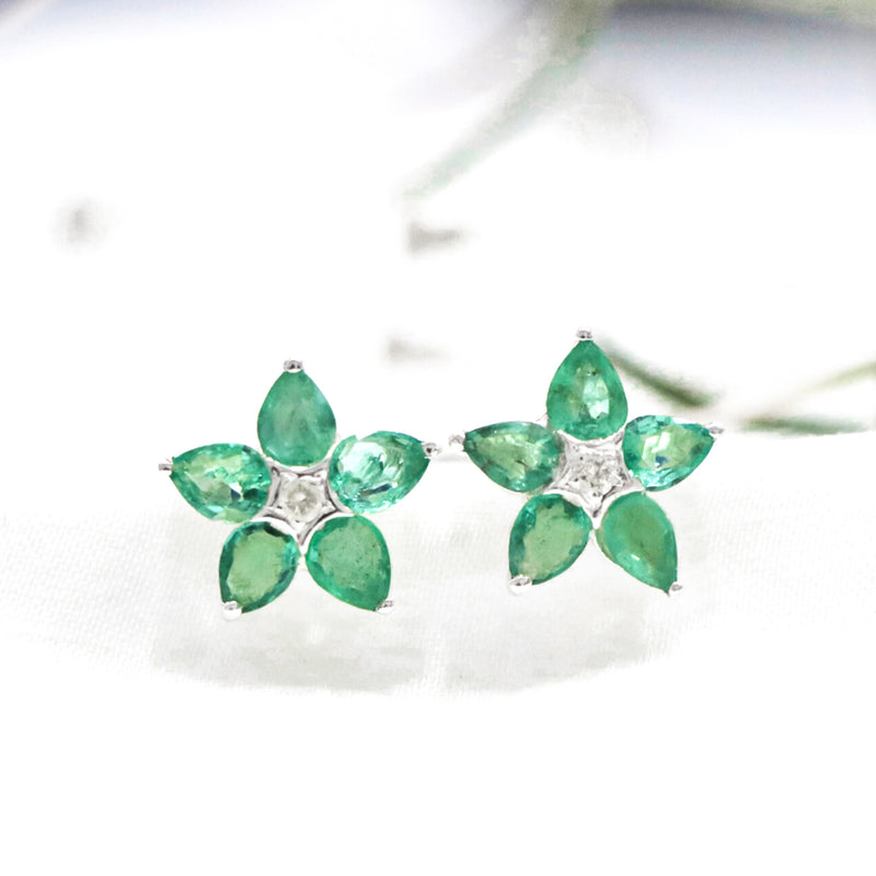 Handcrafted in 925 Sterling Silver Emerald Stone Earring Floral Shape Studded Cubic Zirconia At The Center Of The Earring Design With White Background 