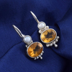 Handcrafted in pure 925 sterling silver Citrine Stone  Oval Shape Earrings vibrant look which makes it a perfect choice to wear on occasion Stud With Top OF the Earring With Pearl Attach Look Nice After Wear With  Background  Navy Blue 